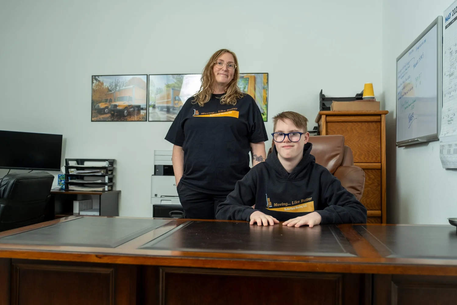 Butterfield office staff at a desk, office relocation in Milwaukie