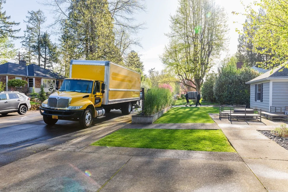 Butterfield truck parked at the curb beside a green lawn, move in Woodburn