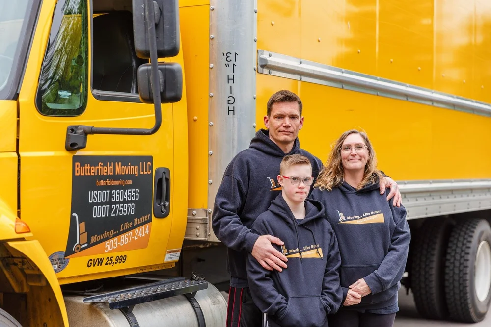 Butterfield owner with family in front of the truck showing DOT numbers, move in Wilsonville