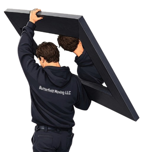 Two movers from Butterfield Moving LLC carry a large, framed piece of furniture.