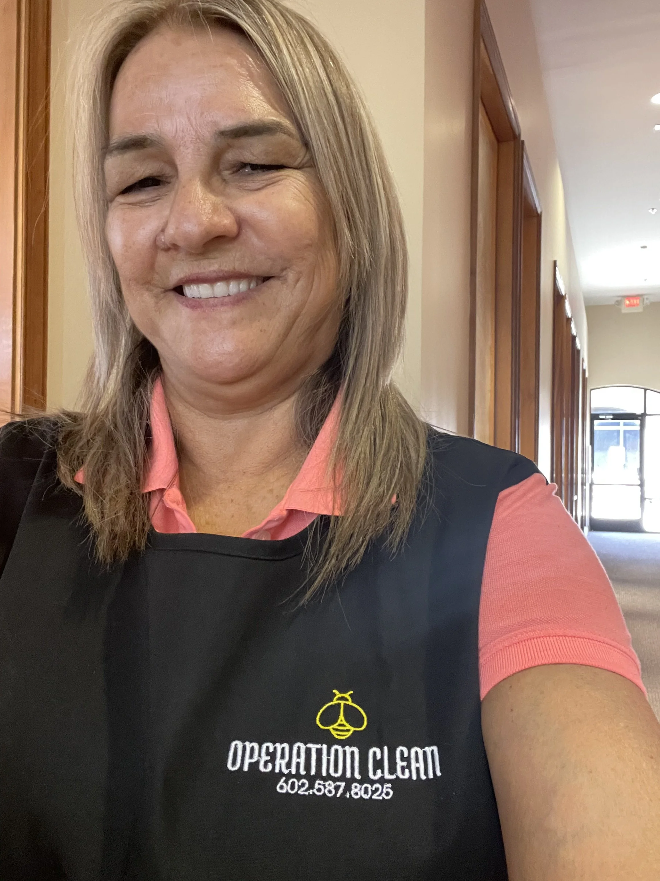 Operation Clean team member wearing a branded cleaning uniform