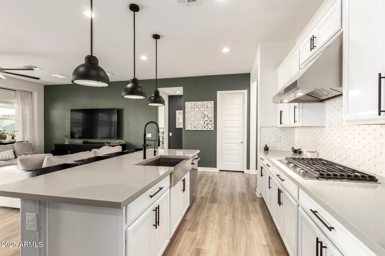 Clean open-concept kitchen and living area prepared for guests