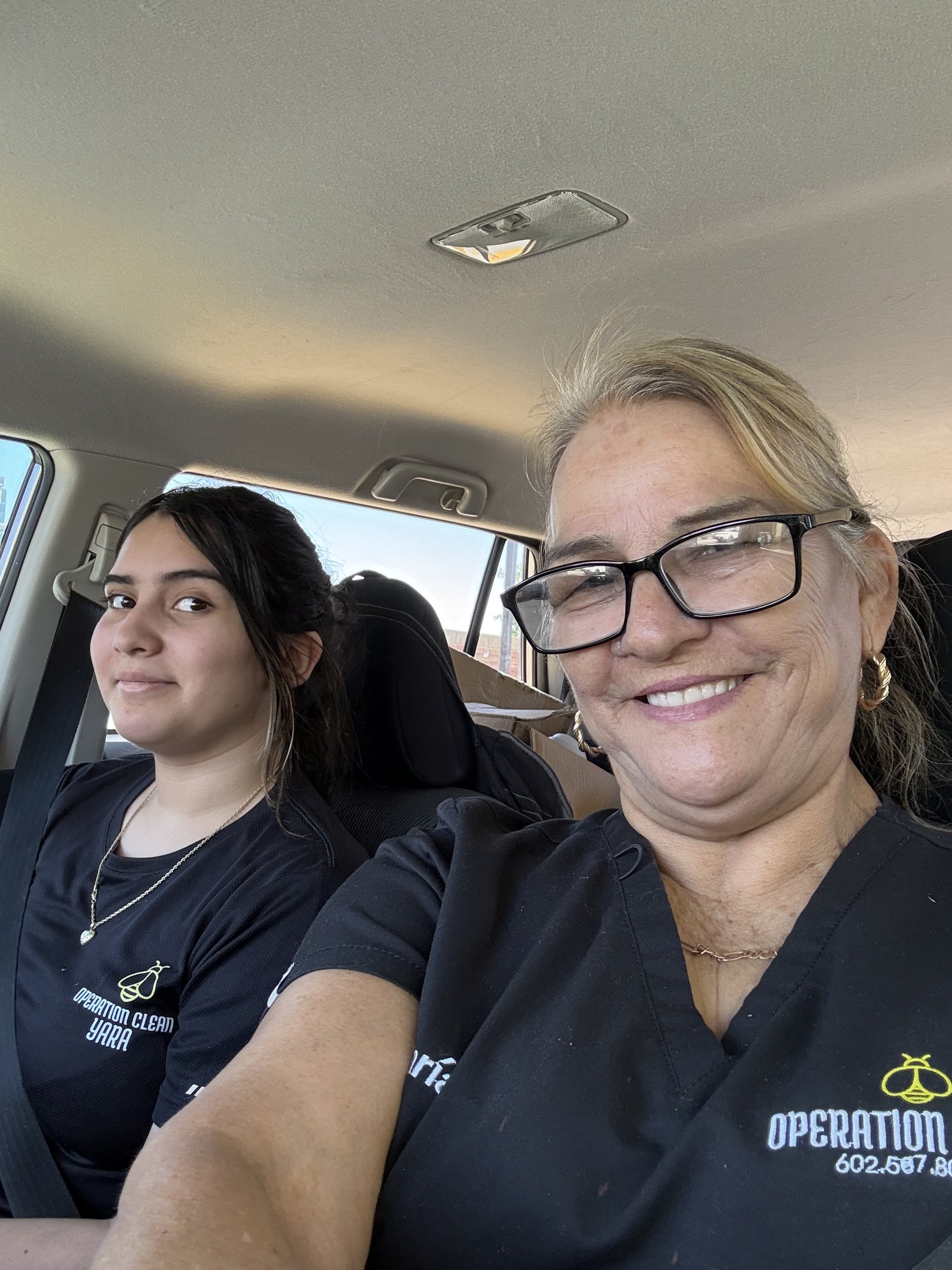 Operation Clean team members wearing branded company shirts