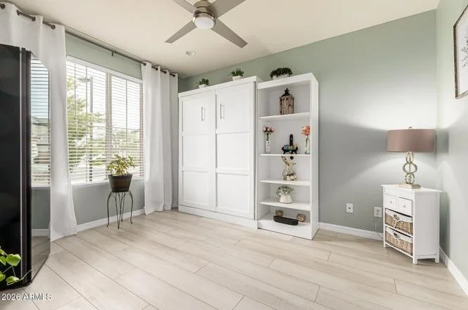 Clean half-bath with polished fixtures and herringbone tile floor