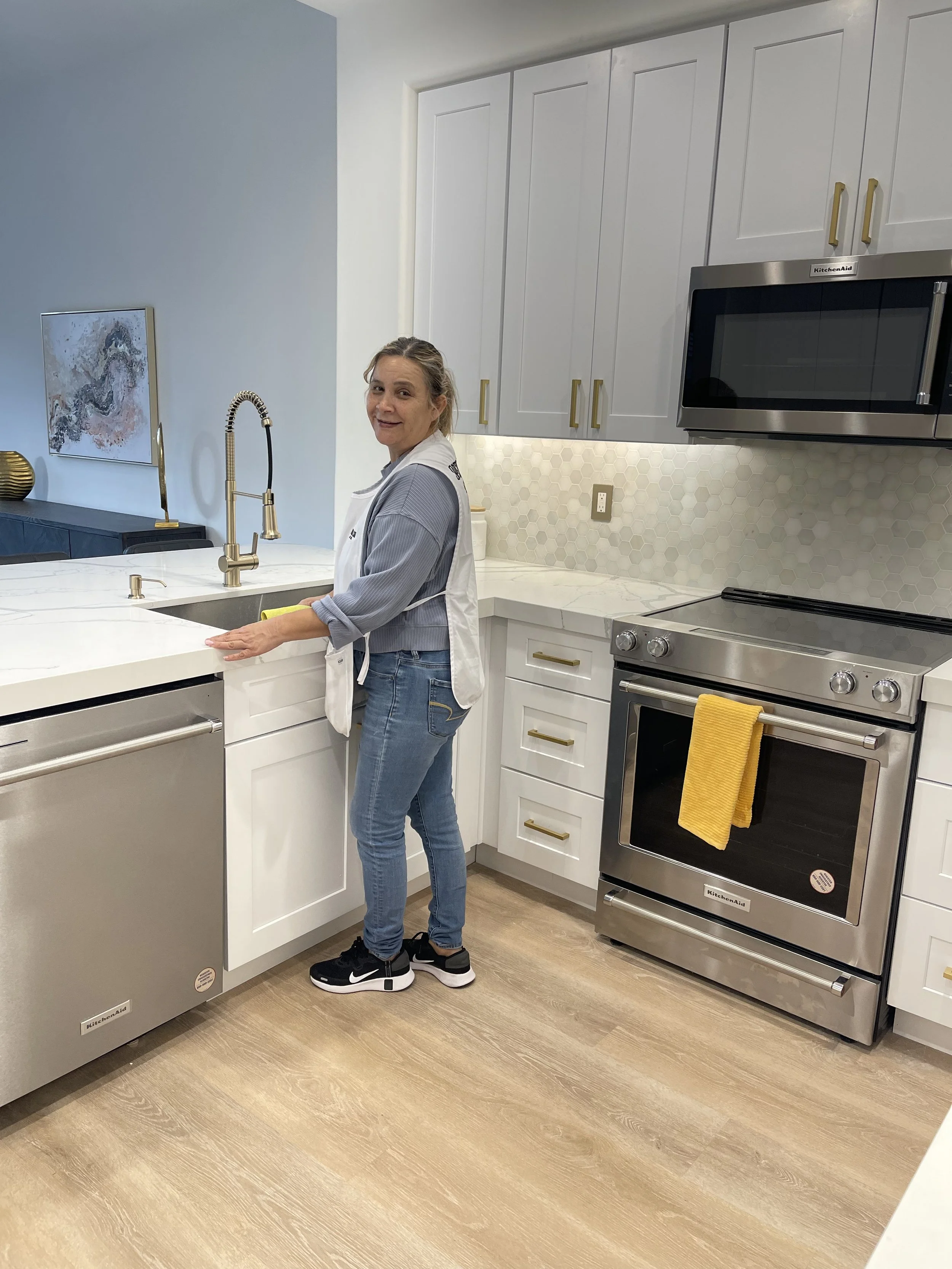 Operation Clean team member in uniform inside a finished kitchen