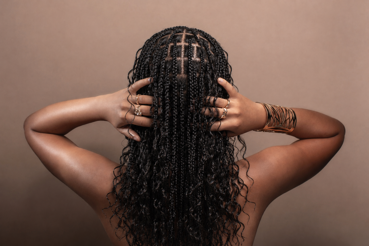 Long braided protective hairstyle at Iconique Hair Salon in Whitby, Ontario. Premium braiding and natural hair services for women in Durham Region, Ajax, and Oshawa.