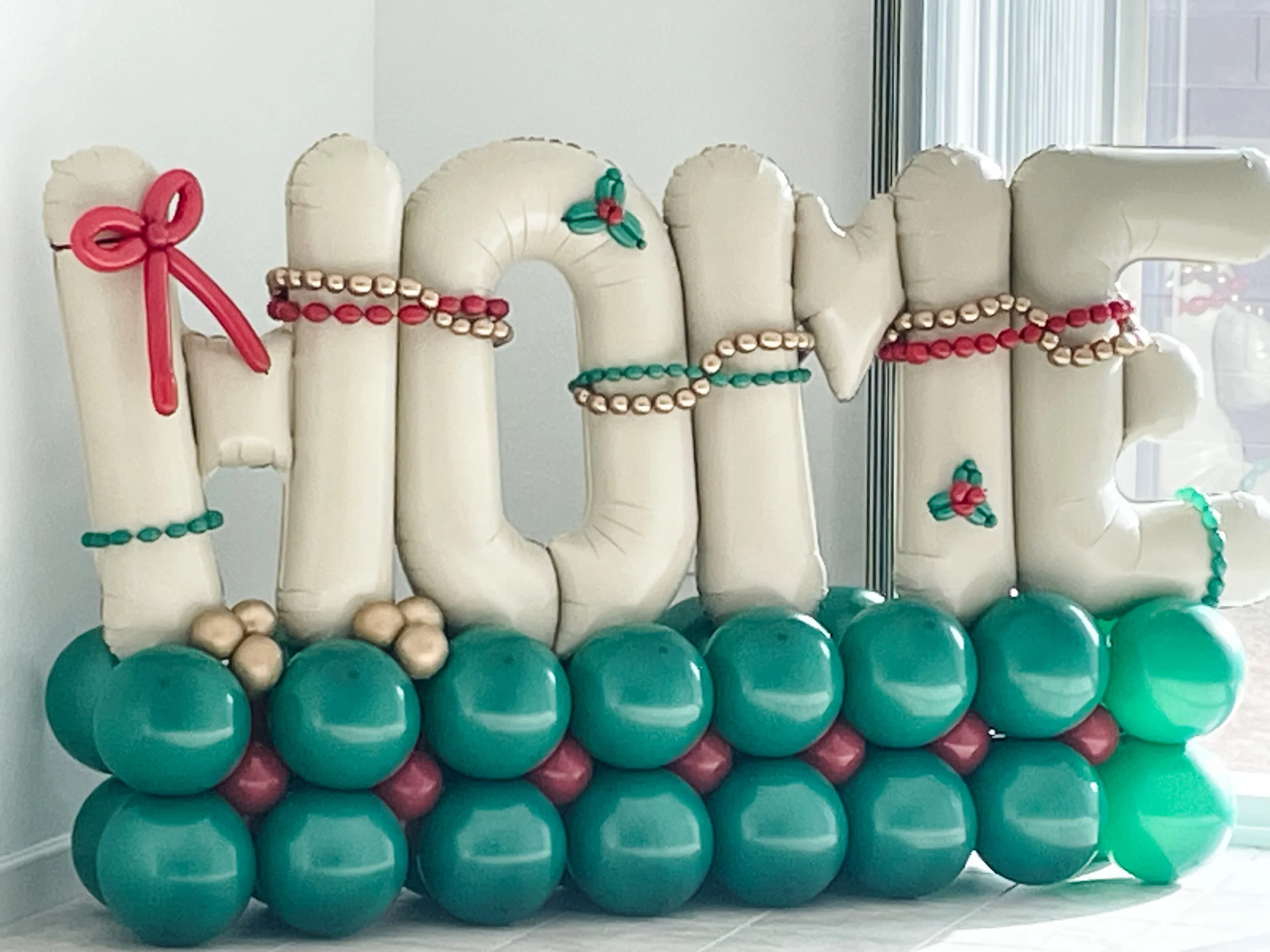 Christmas themed "Home" balloon stack for housewarming.