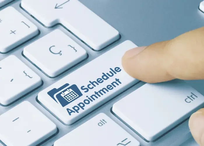 Keyboard with a button labeled 'schedule Appointment' being pressed.