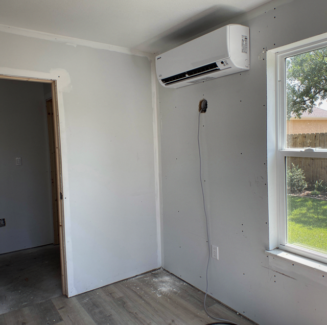 mini-split wall unit cooling a converted garage space