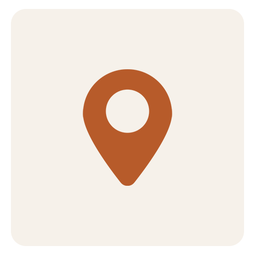 Icon of a map pin or location marker on a beige background.