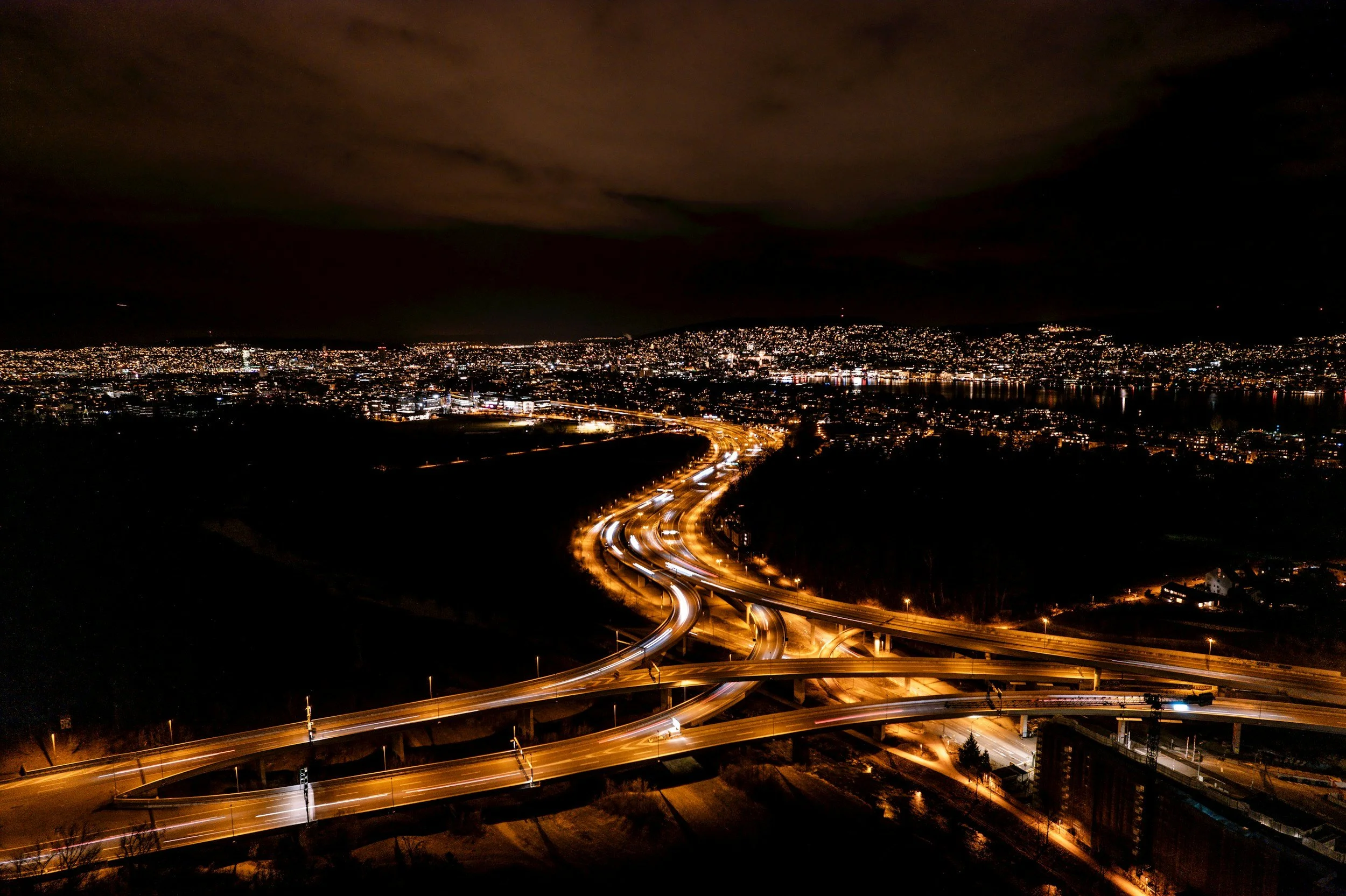 Night transportation network representing logistics, infrastructure and operational advisory across complex markets.