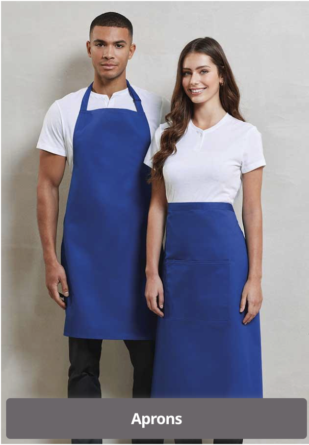 A man and a woman standing side by side, both wearing blue aprons over white shirts, in front of a plain light-colored background.