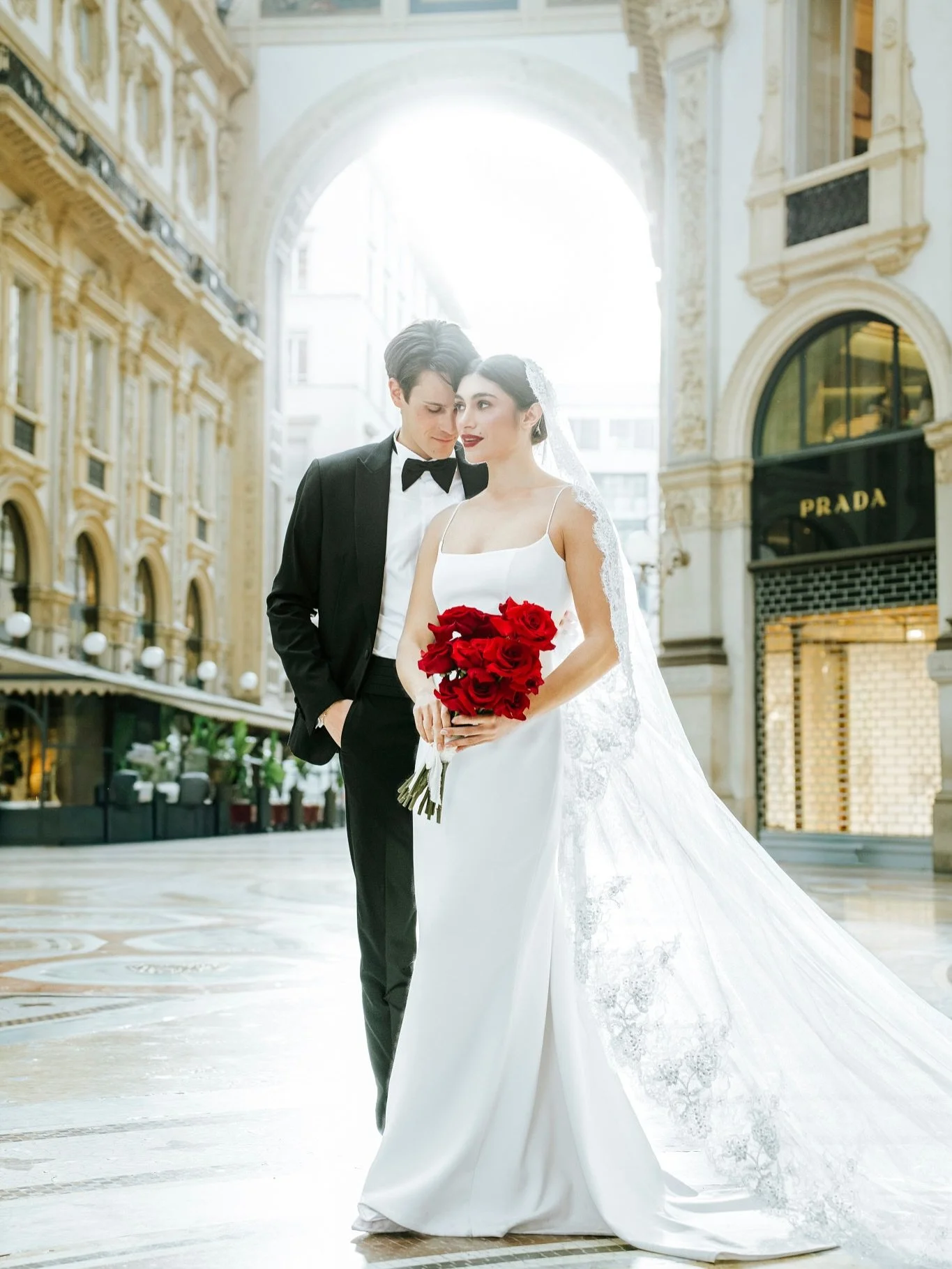 A quiet moment of elegance in the heart of Milan.

Soft light, timeless architecture, red roses, and the kind of love story that feels both cinematic and deeply personal.

Destination wedding photography in Italy &amp; Europe.

Event Planning &amp; c