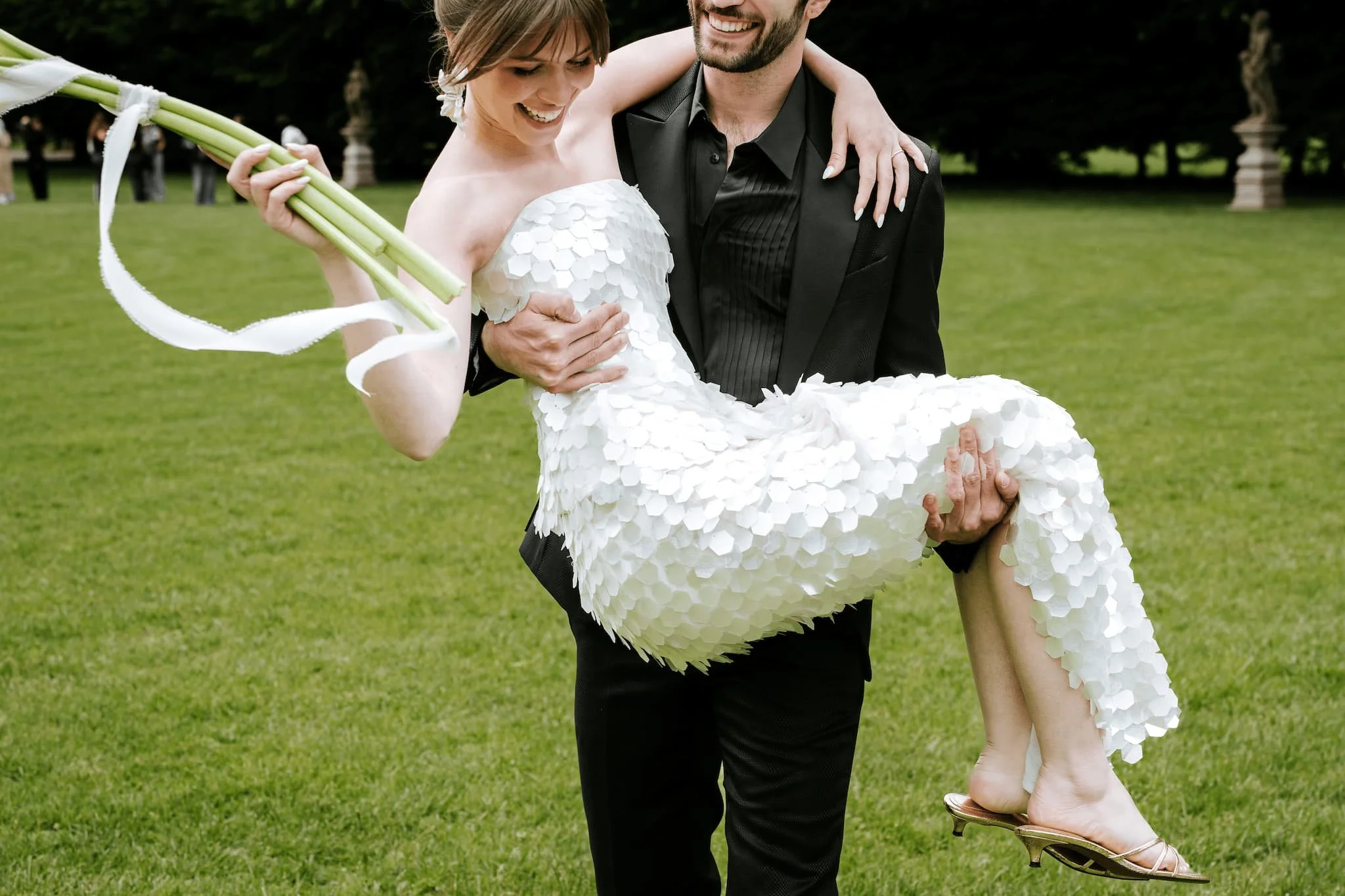Bride and groom celebrating with champagne during a Lake Como wedding with elegant lakeside styling and mountain views.