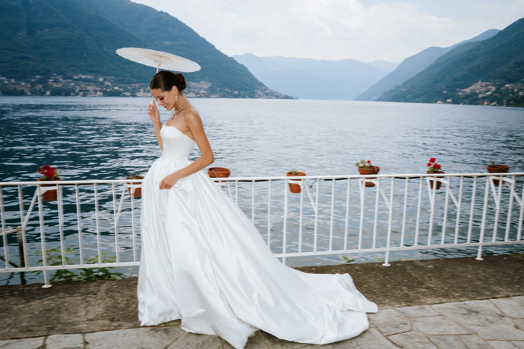 Lake como luxury bride photo walking by the lake