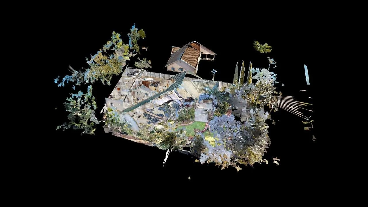 3D laser scan of a residential backyard and house with trees, fences, and garden areas, shown in a digital point cloud visualization against a black background.