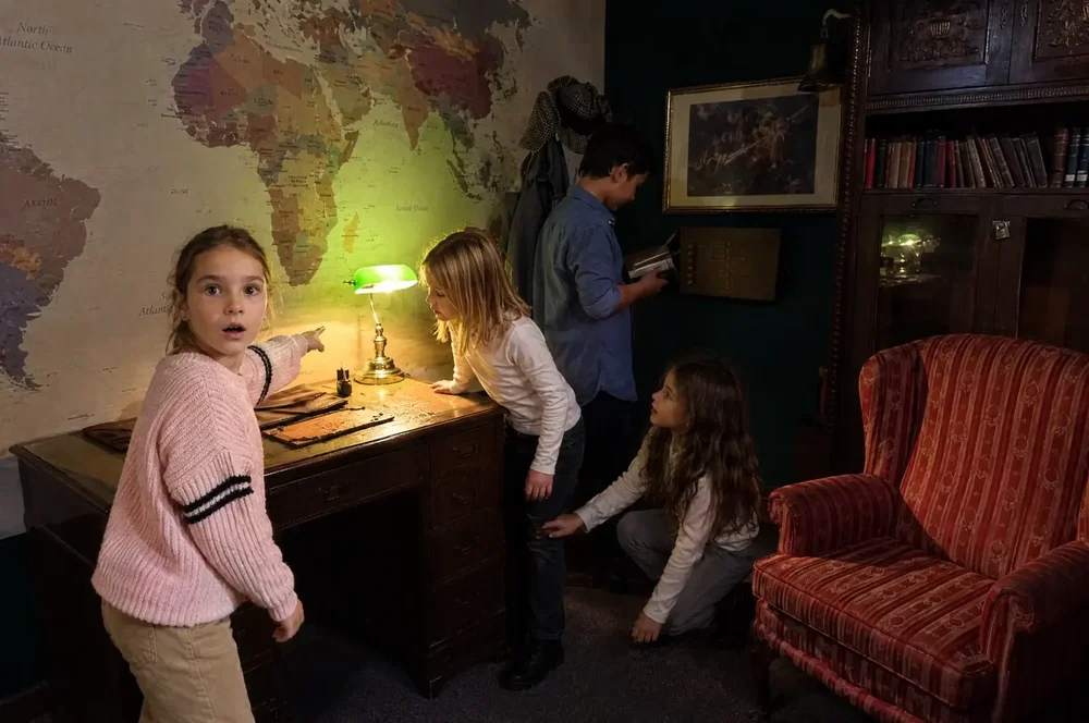 Birthday group solving clues inside the 221B Baker Street escape room at Escape London