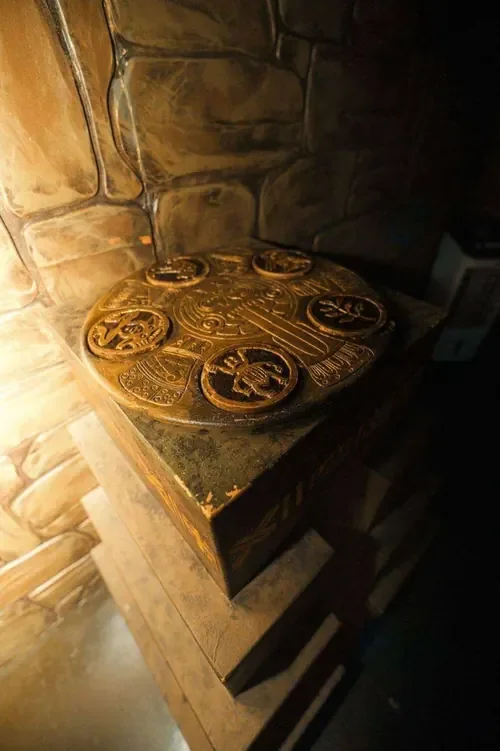 A glyph-covered relic box on a stone plinth in Mayan Temple — Escape London Whitechapel