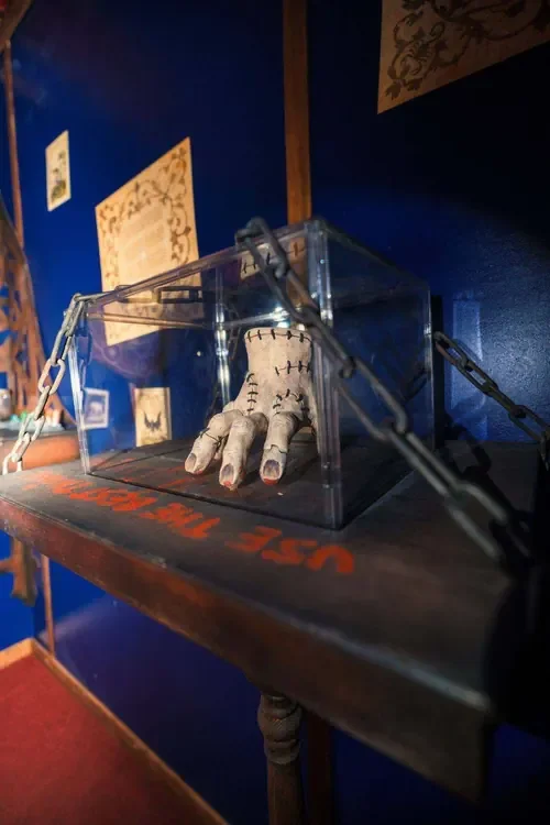 A severed hand sealed in a chained glass case in Young Wednesday — Escape London Hammersmith