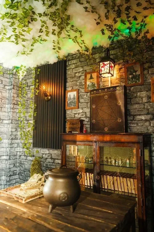 The potions cabinet, cauldron and enchanted ceiling of Witchcraft & Wizardry — Escape London Whitechapel