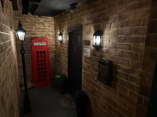 The 221B Baker Street entrance with red telephone box — Escape London Islington