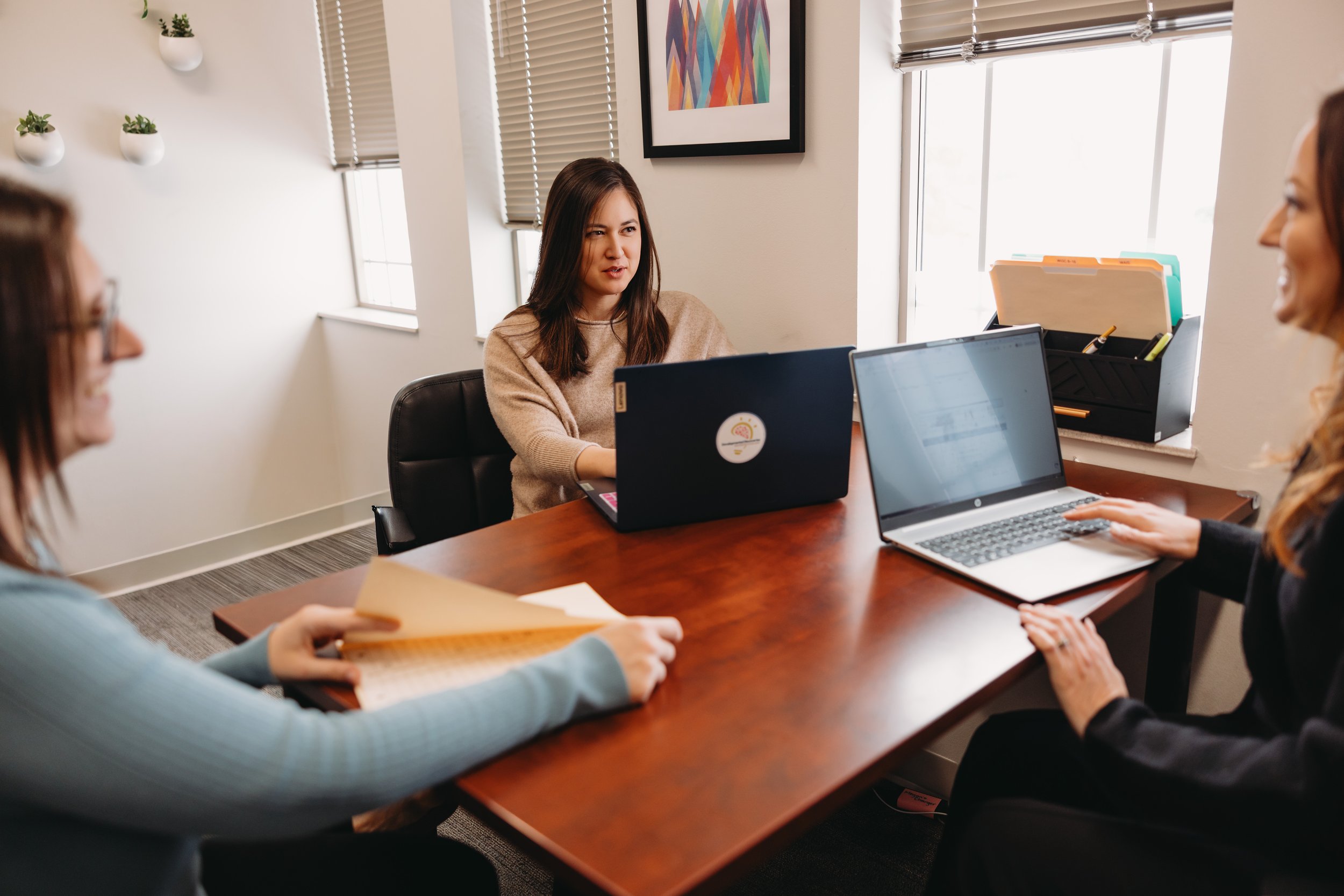 Professional consultation meeting in a neuropsychology practice, supporting collaborative neuropsychology consulting and clinical consulting services.