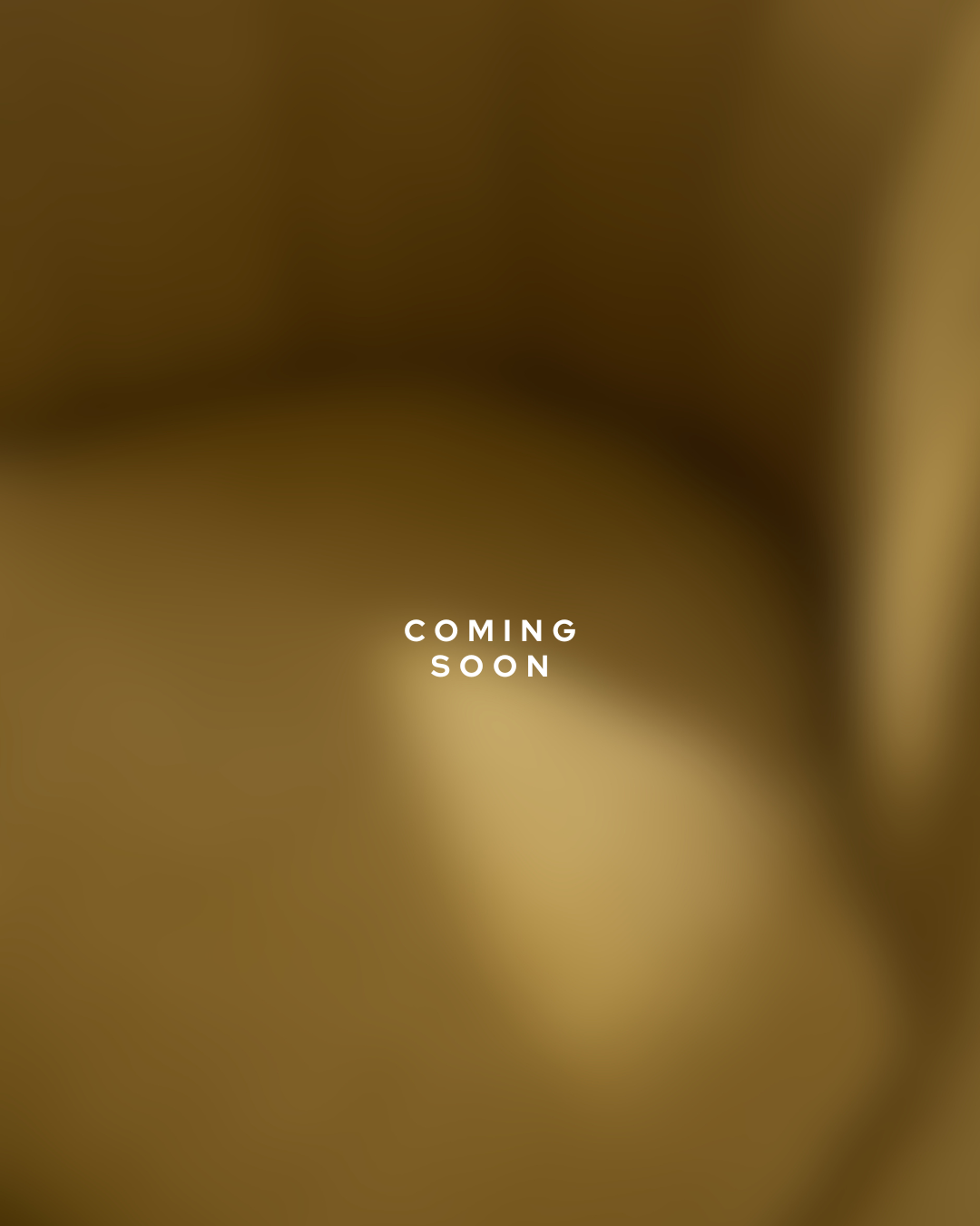 Blurry, warm-toned background with weißem Text "COMING SOON" in der Mitte.