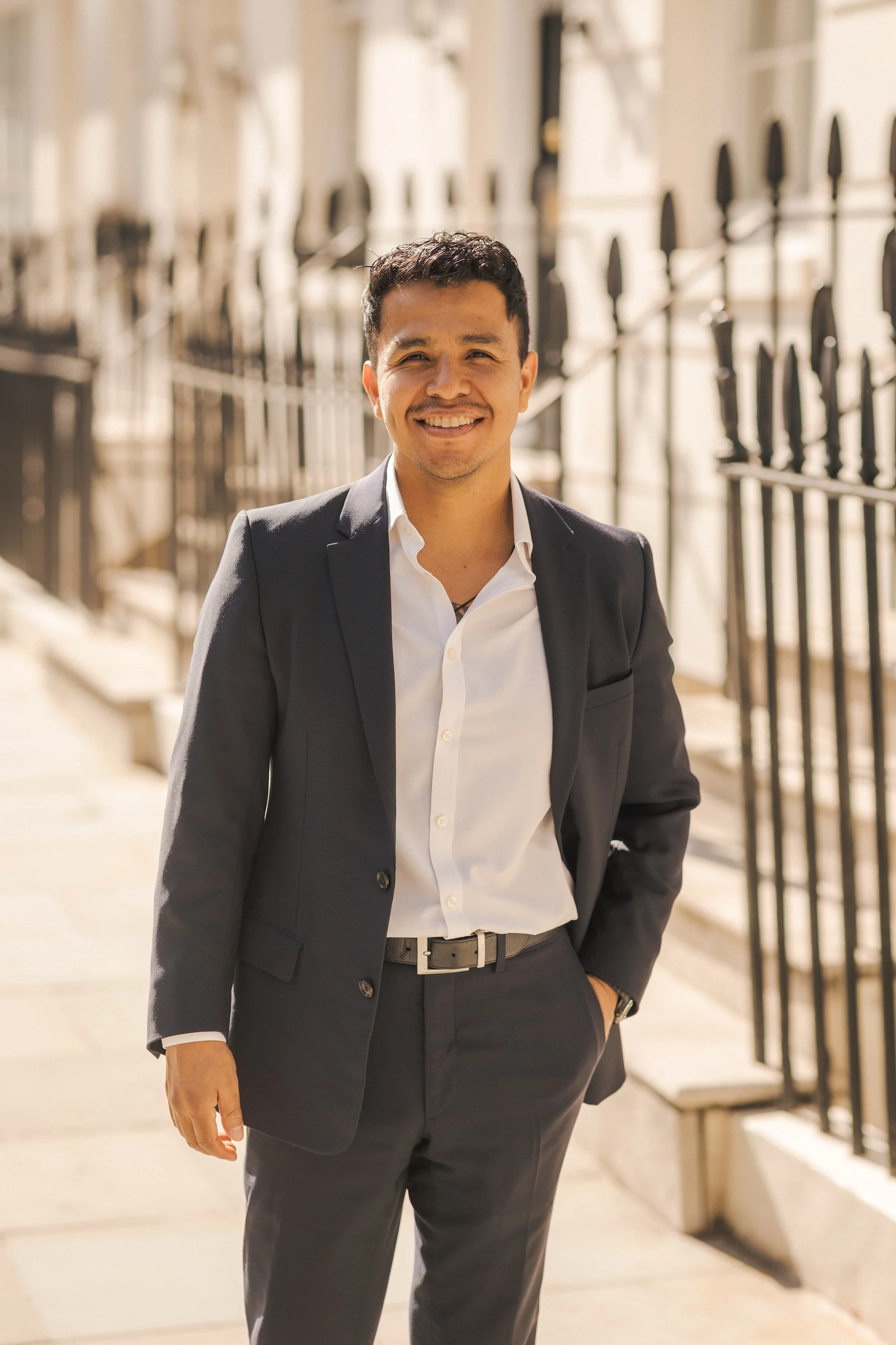 Man in suit standing and smiling