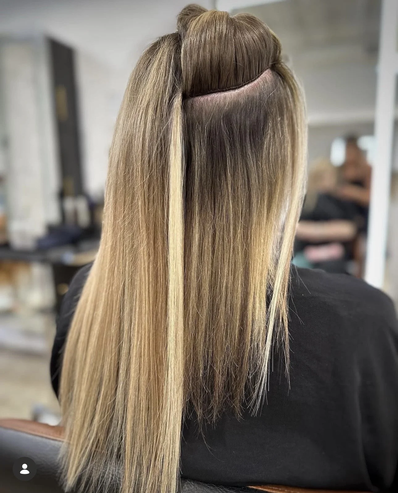 Hand-tied hair extensions installation process at Amber Marquez Hair