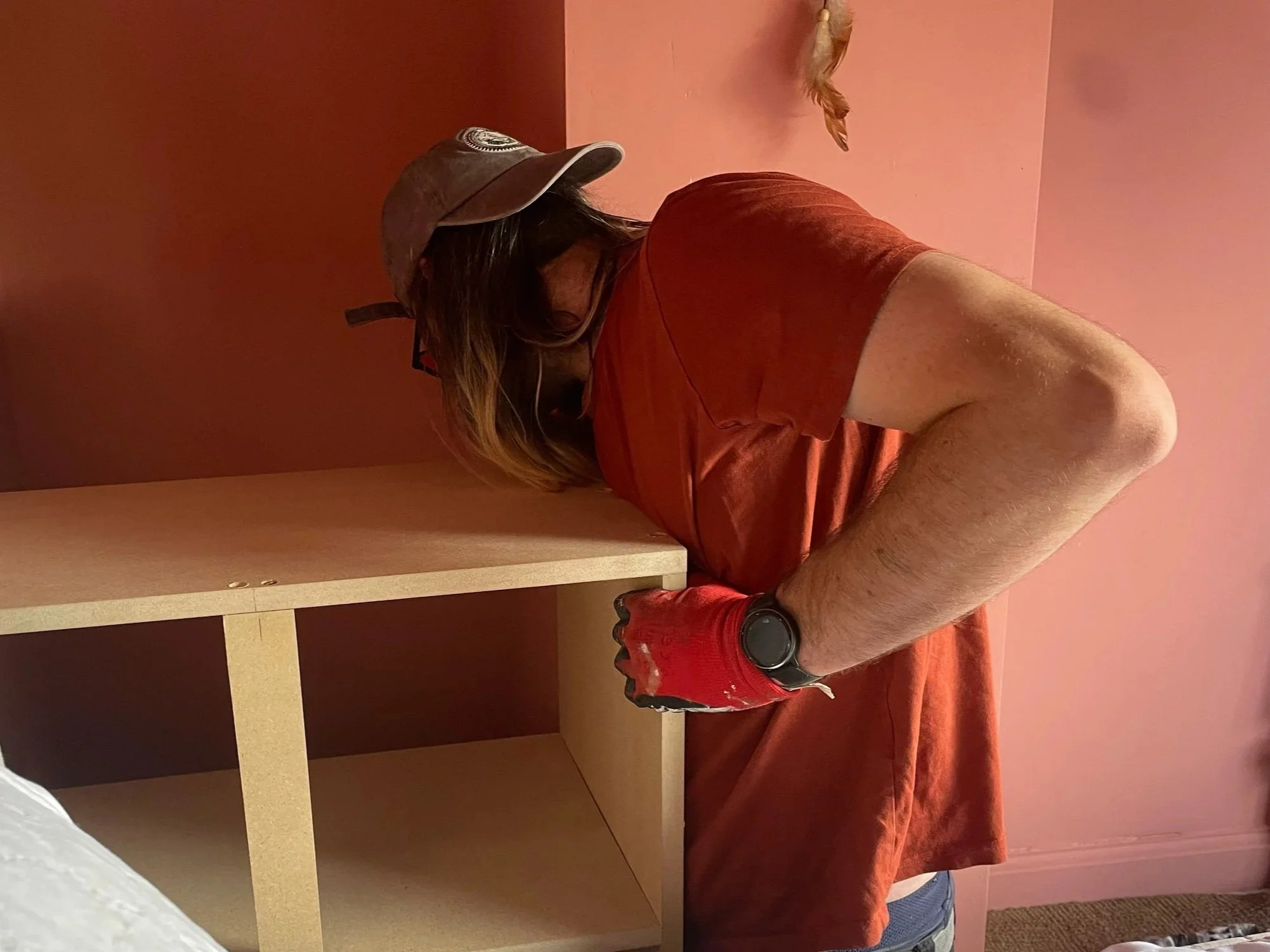 Bristol tradesman Finn Magee  fitting custom built-in to 1930s property in St George, Bristol..