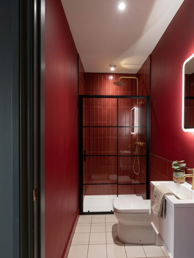 Deep red tiled walk-in shower room and modern vanity installation in Knowle, Bristol.