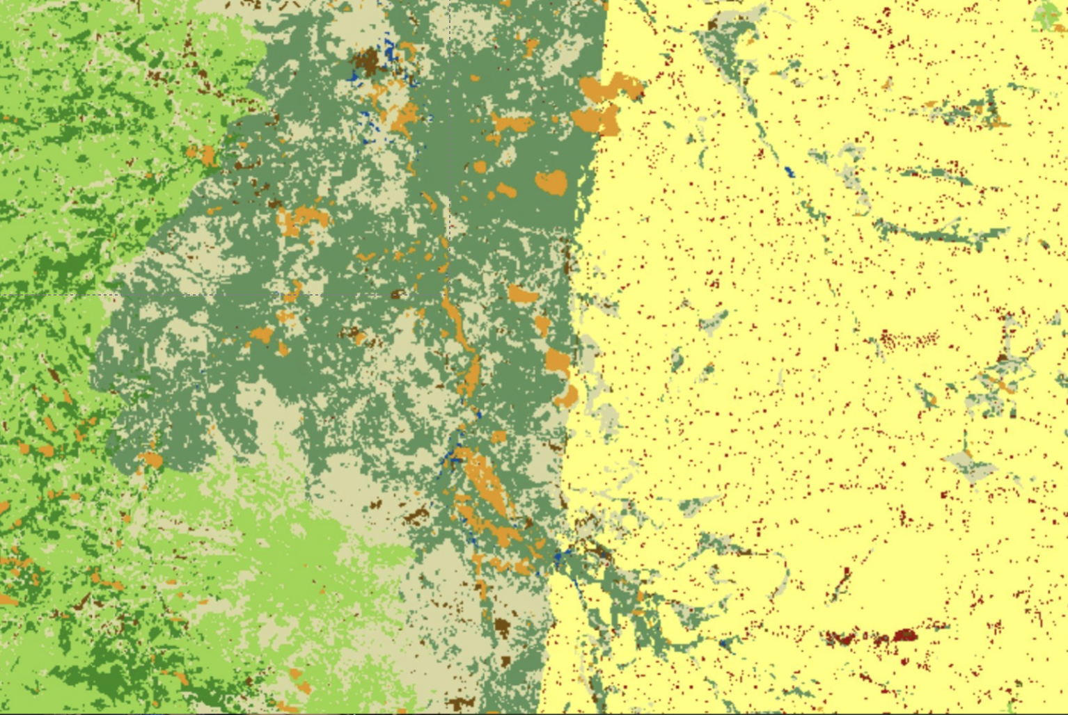 A map showing different land types with varying colors: green for forested areas on the left, gray and orange areas indicating urban or developed land, and yellow with scattered red dots on the right representing desert or arid regions.
