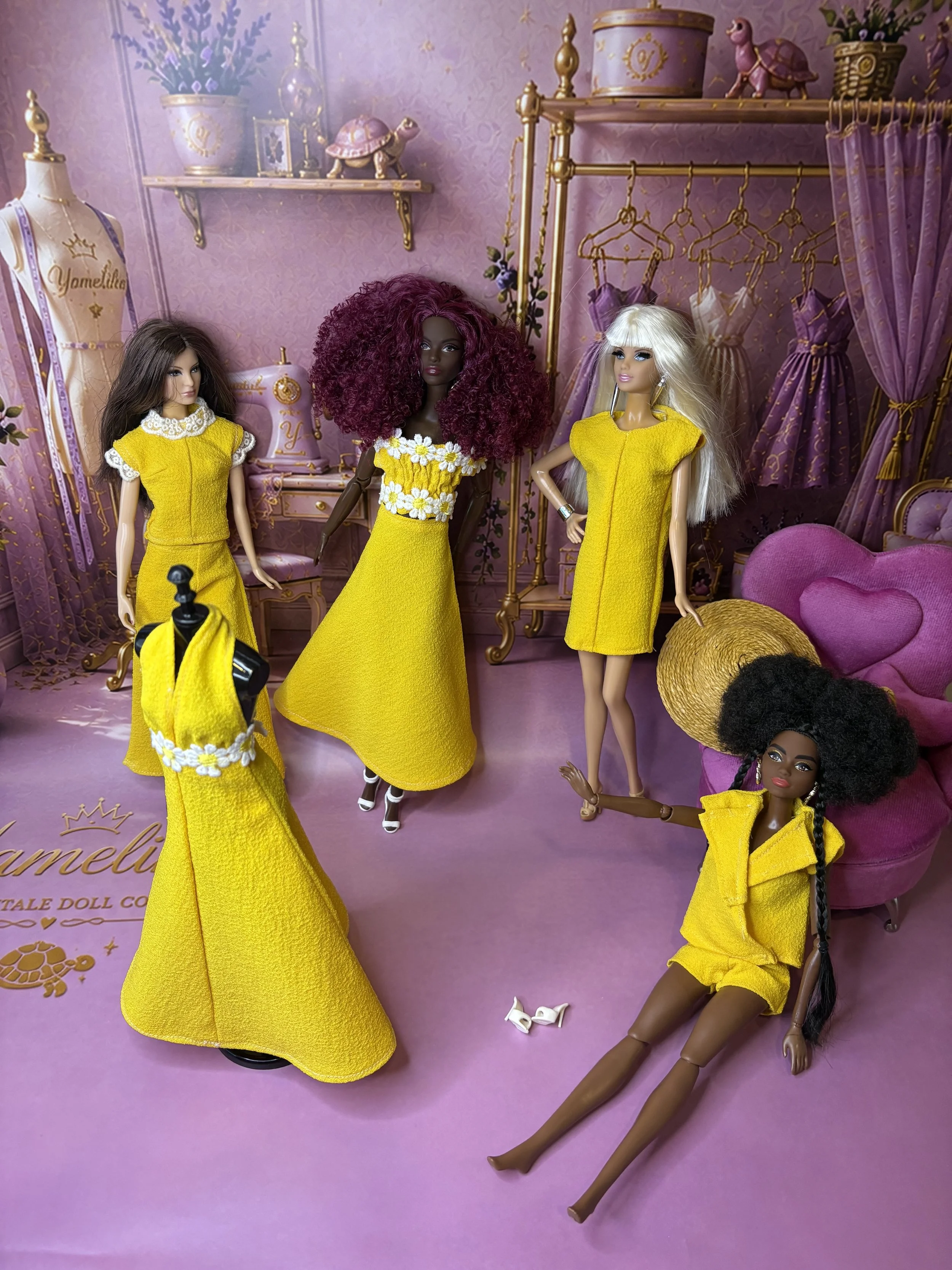 Complete Lemon Drop fashion doll collection by Yamelika, featuring handmade yellow doll dresses, trousers, tops, shorts, a straw hat and woven miniature bag.
