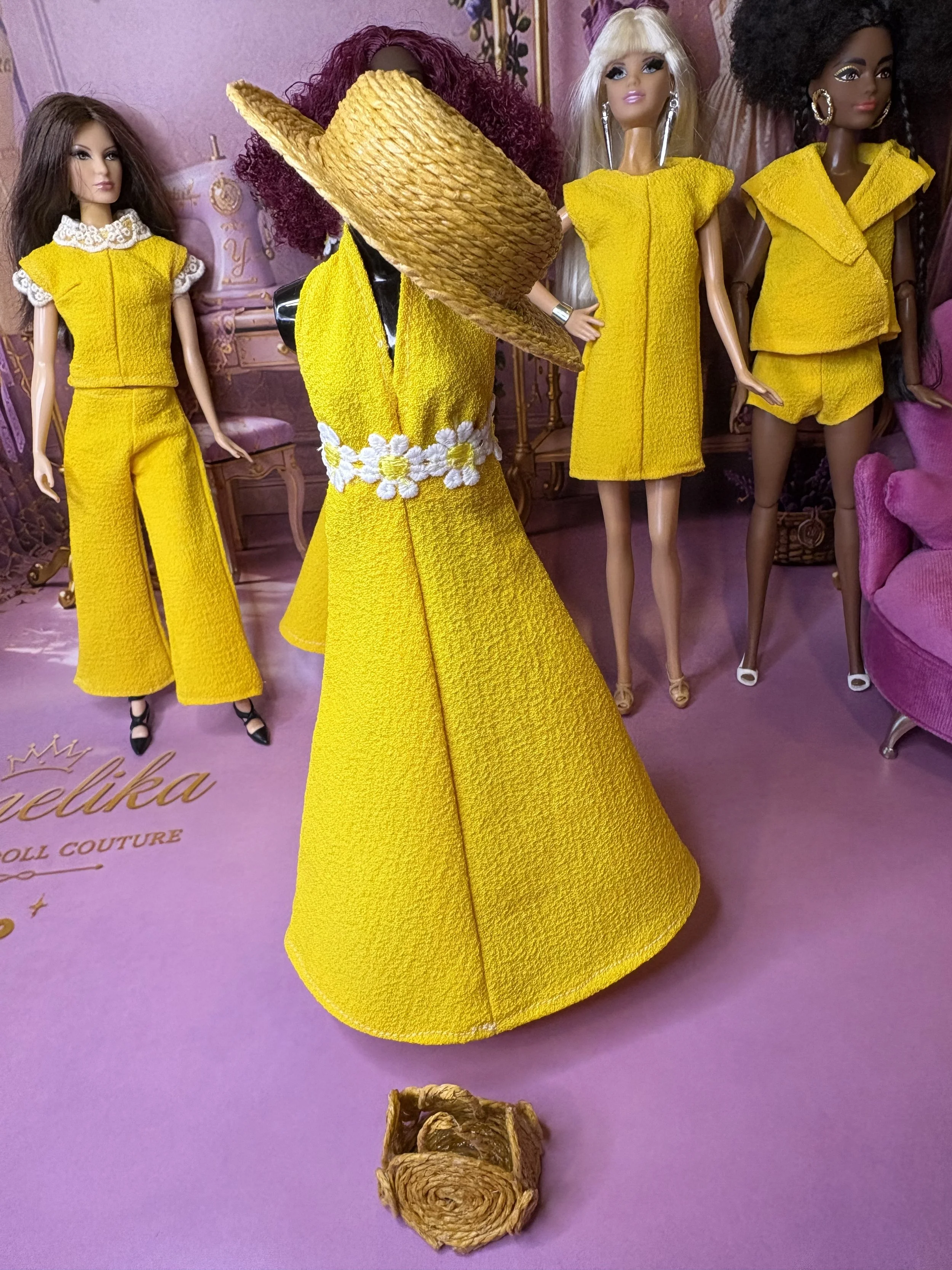 Handmade fashion doll clothes and accessories from Yamelika’s Lemon Drop collection, displayed together with yellow dresses, separates, a straw hat and miniature woven bag.