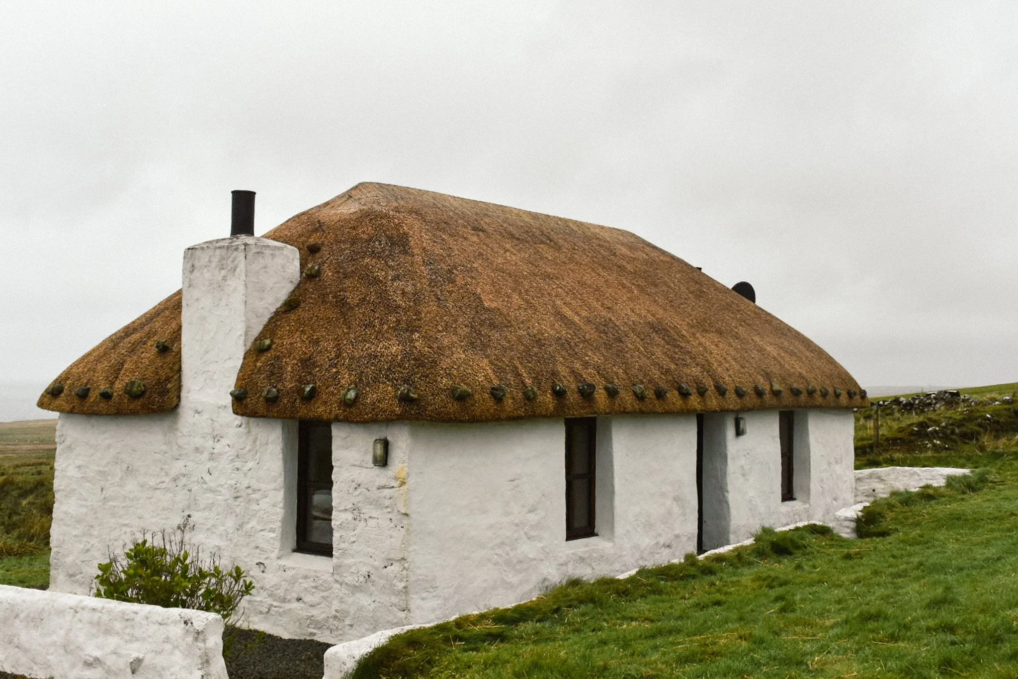 The finished cottage on the Isle of Skye. Scottish water reed and weighting stones.