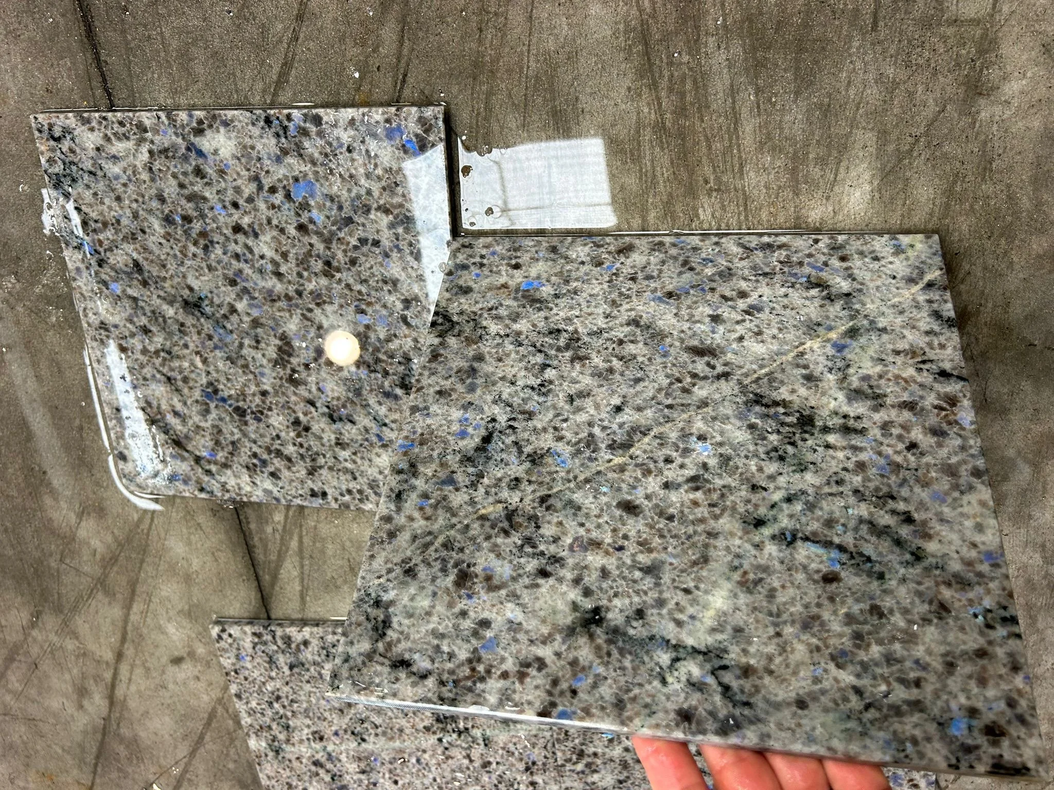 Blue-Eyes Labradorite tile, quarried from Labrador Canada displaying natural labradorescence. Atlantic Stoneworks in partnership with Mark Brace of Ocean Floor Granite. As seen on Dragon’s Den.