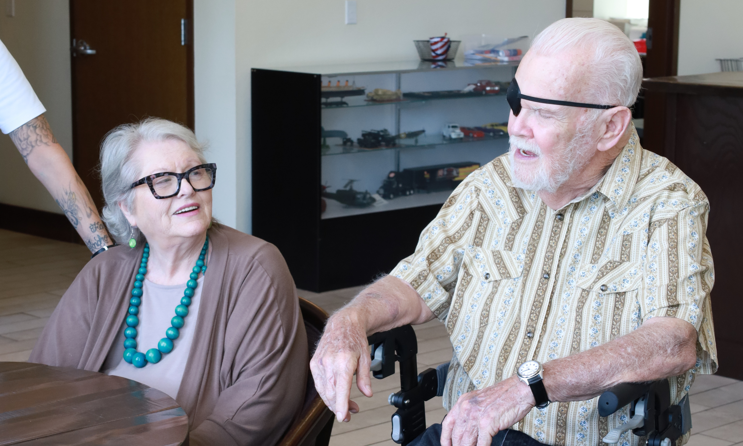 Residents in our Arkansas State Veterans Home laughing together. 