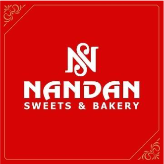 Red square logo for Nandan Sweets & Bakery with white text and decorative corner accents.