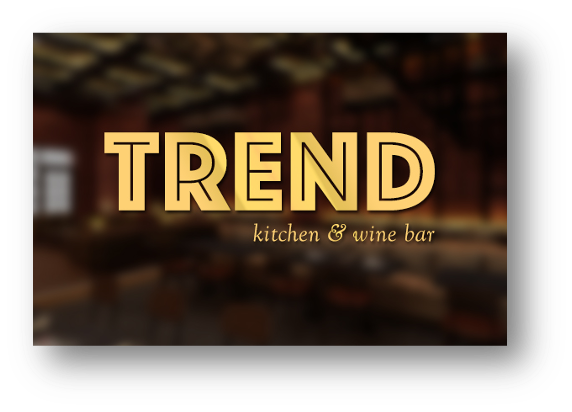 Logo for 'TREND kitchen & wine bar' with a blurred background of a kitchen or wine bar interior.