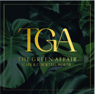 Logo for TGA The Green Affair Cafe & Cocktail House with green tropical leaves in the background.