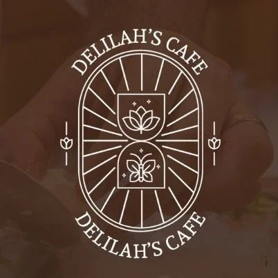 Logo for Deliha's Cafe with a lotus flower and butterfly design