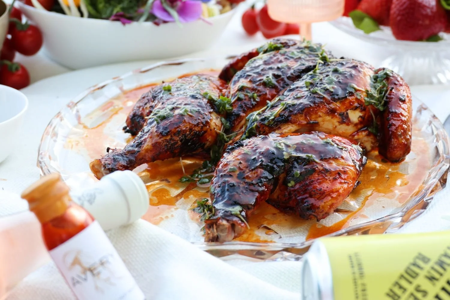 Close up of glazed chicken on a white tablecloth that comes with the gourmet picnic — Kilted Chicken by Chef Rodney Wages