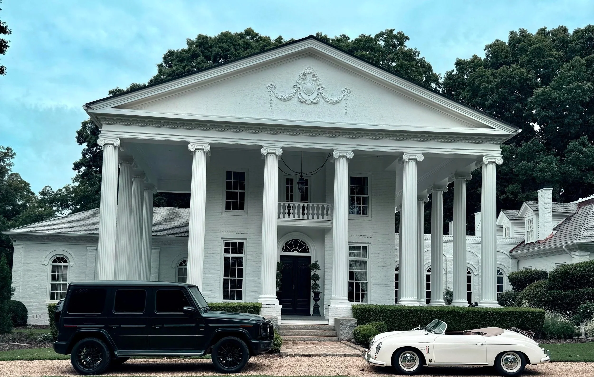 The Grand Exit Motorcars with our Ivory Porsche 356 and Onyx our matte black Mercedes Benz G-Wagon 550 outside a wedding venue in Madison, Georgia. Available for rent in Atlanta and the greater area in North Georgia