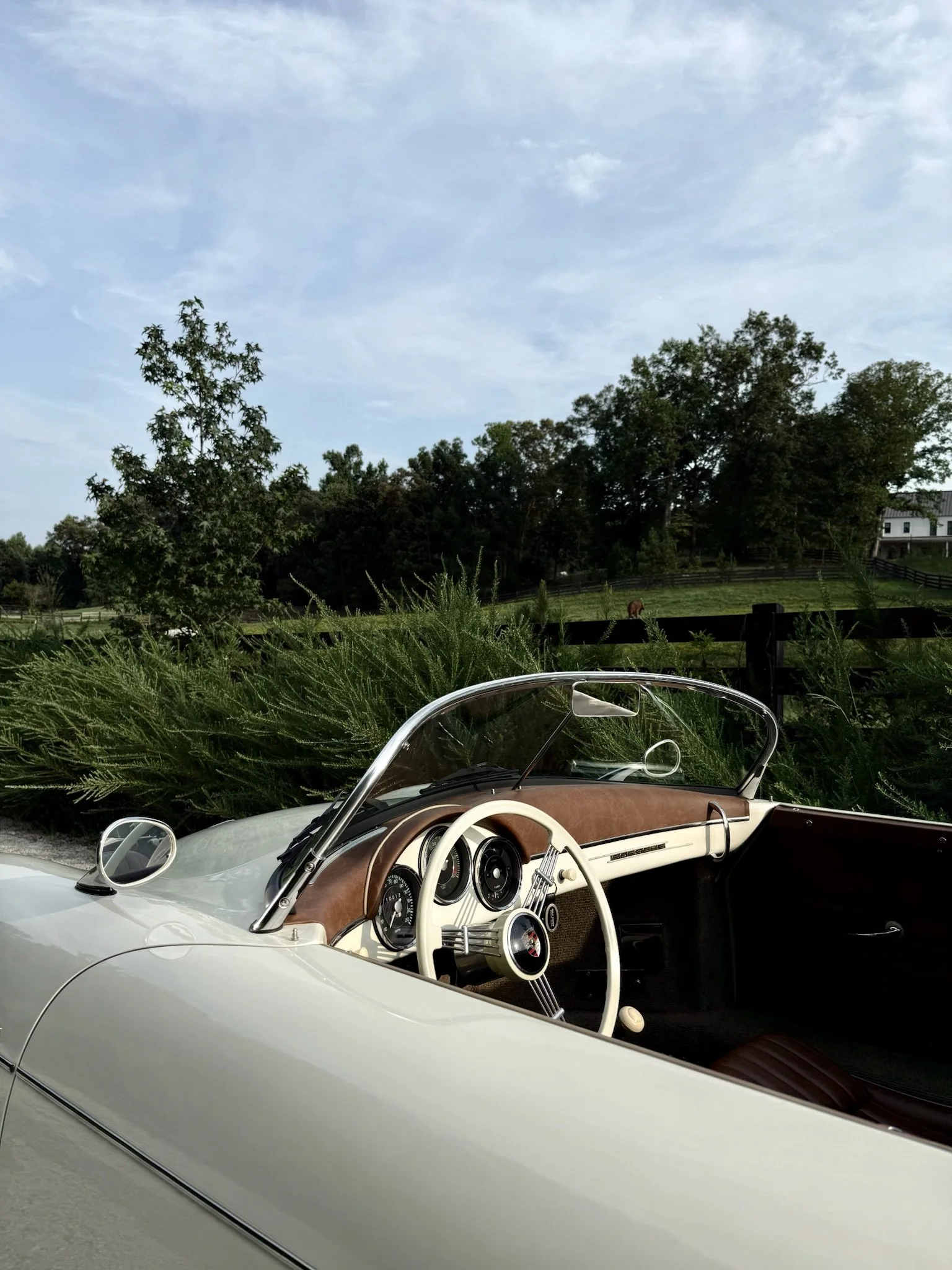 Close-up of leather and banjo steering wheel details on classic Porsche 356 Speedster classic replica rental car