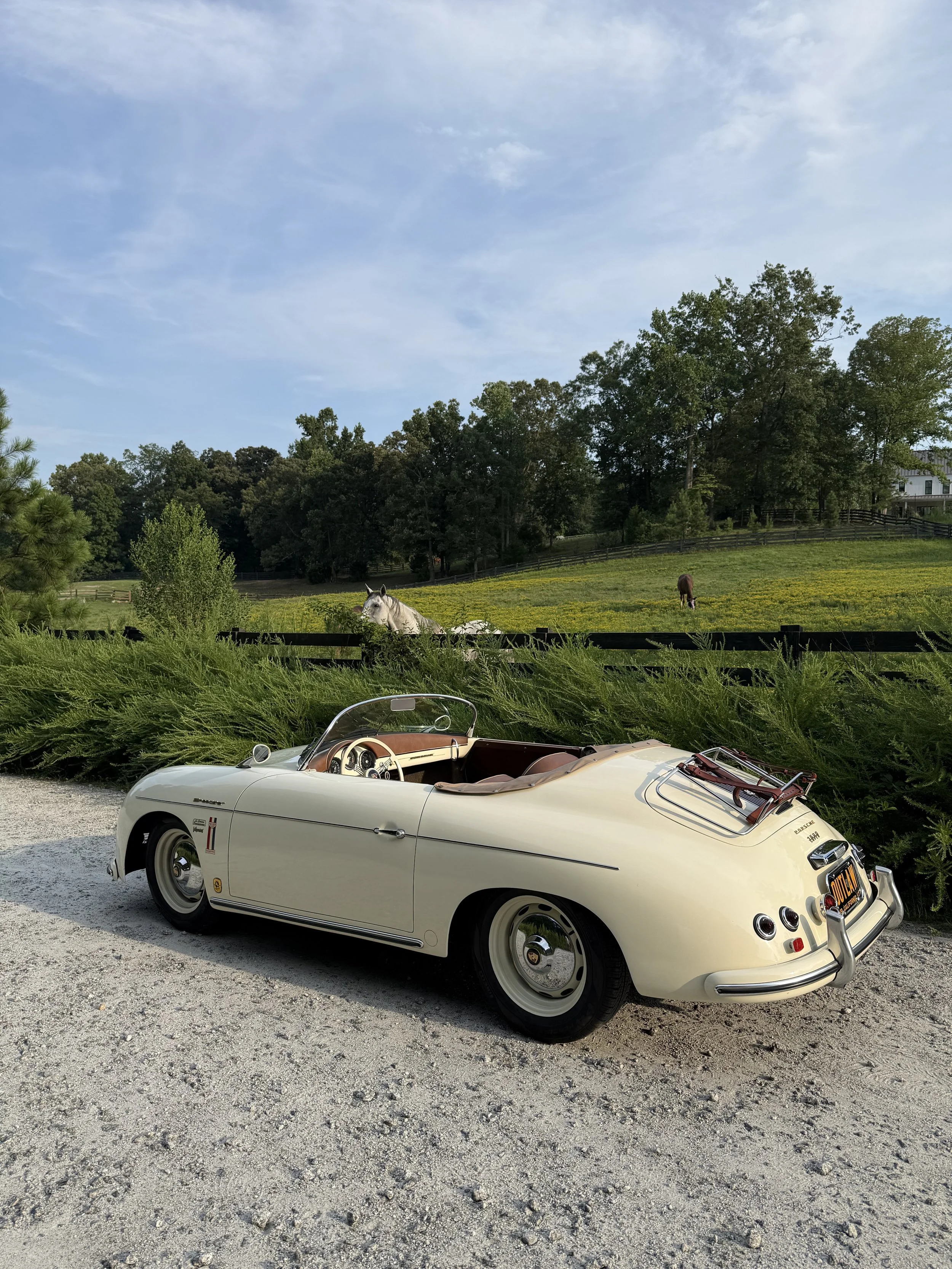 Rear three-quarter view of cream 1957 Porsche 356 Speedster classic car replica, Athens, Ga wedding rental