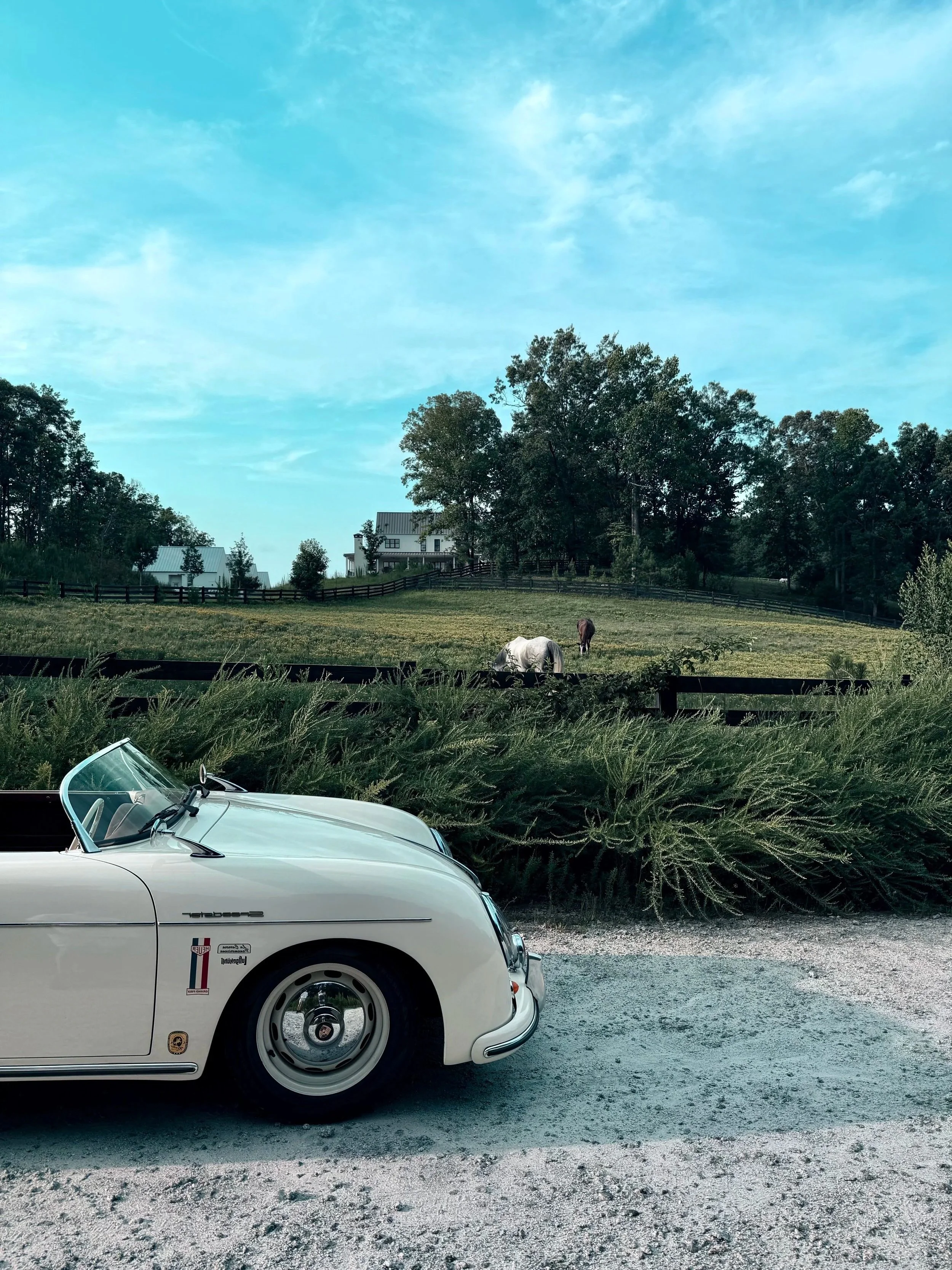 Side profile three-quarter view of cream 1957 Porsche 356 Speedster replica, Alpharetta wedding rental