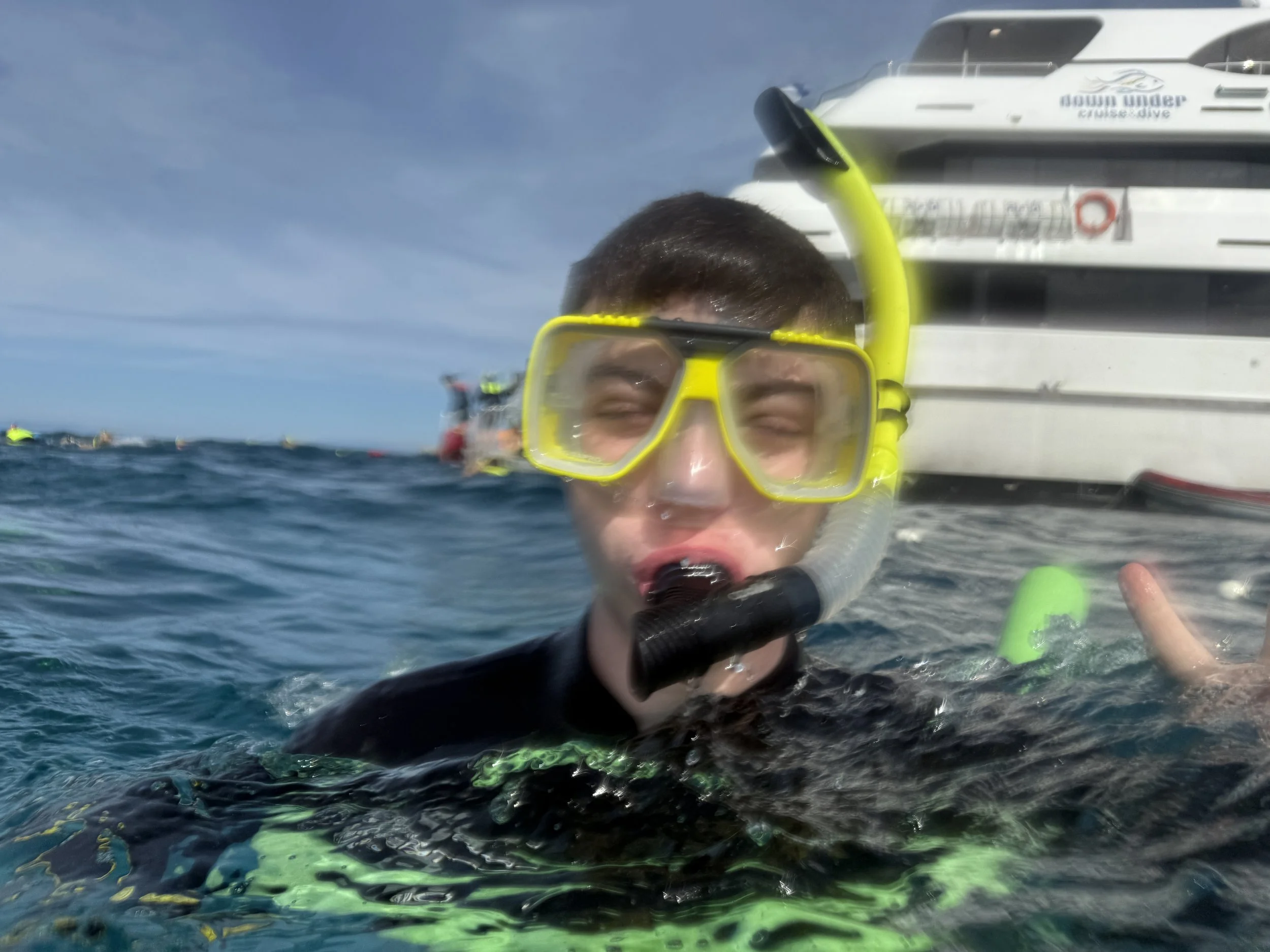 Young man in the water wearing snorkel gear