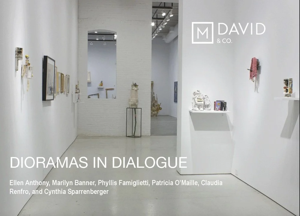 Interior view of an art gallery with white walls displaying various artworks and small sculptures, featuring the exhibition titled 'Dioramas in Dialogue'.