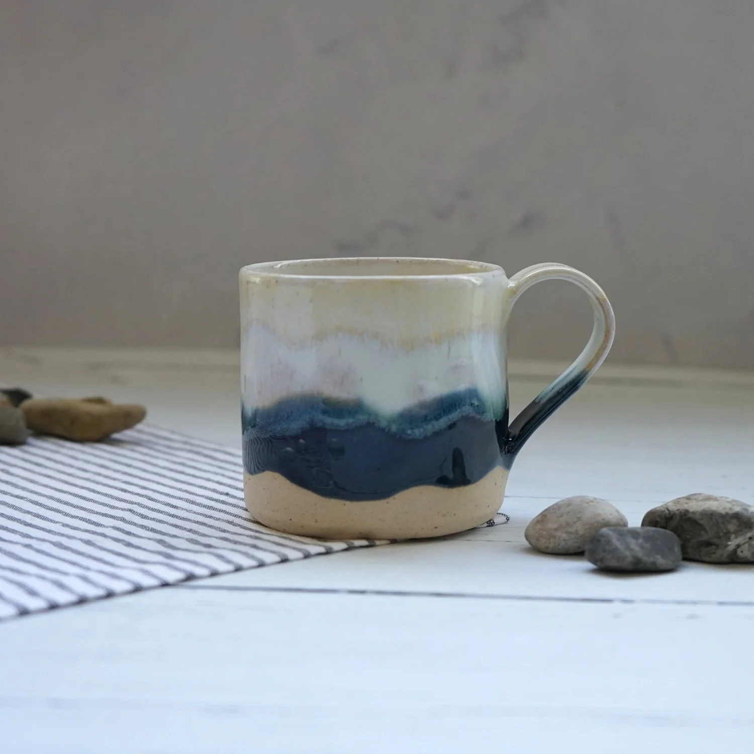 Handmade Ceramic Coffee Mug – Cream and Navy Blue Ocean Wave Glaze