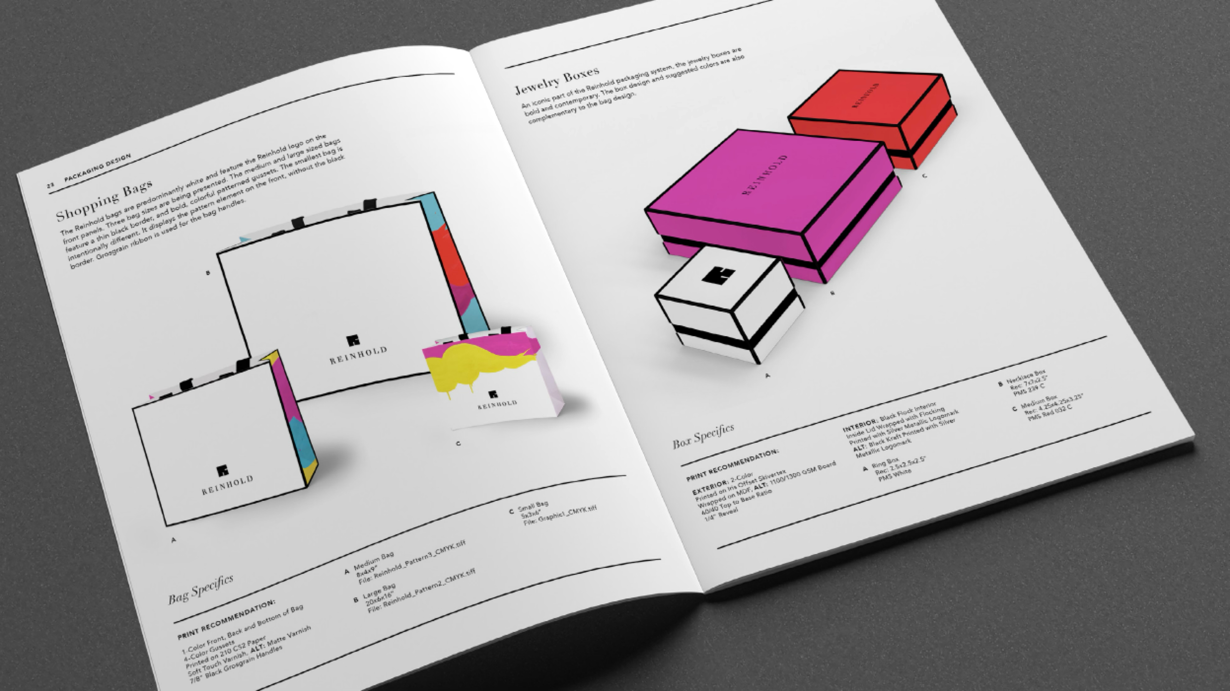 Reinhold Jewelers packaging guidelines for shopping bags and colorful jewelry boxes with black edging.